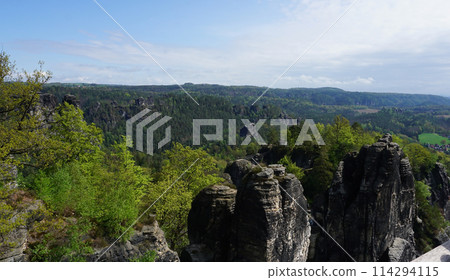 Beautiful summer view of Elbe river from Bastei view pont. Colorful morning scene of Saxon Switzerland national park, Germany, Europe. 114294115