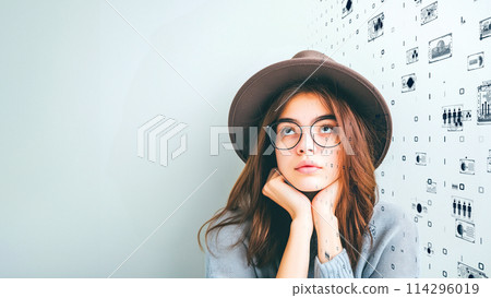 Young woman reflecting on the digital age and pondering the complexities of information technology Young woman reflecting on the digital age and pondering the complexities of information technology 114296019
