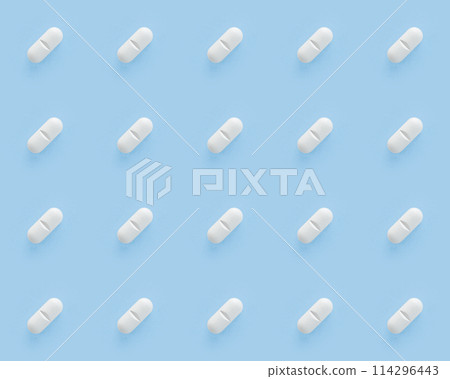 White pills capsules on blue background. Seamless repetitive pills 114296443