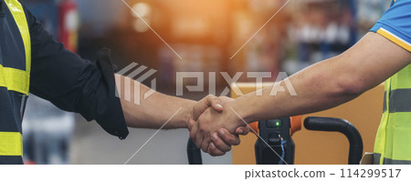 Banner Asian Teamwork Warehouse worker shakehand together. Engineer man, women handshake partnership. Coworker colleague logistics Warehouse teams. Team person shaking hand partner with copy space 114299517