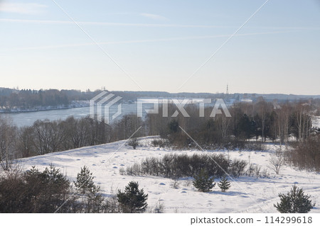 river on a sunny evening. Trees and shrubs. Landscape of winter nature, river banks river on a sunny evening. Trees and shrubs. Landscape of winter nature, river banks 114299618