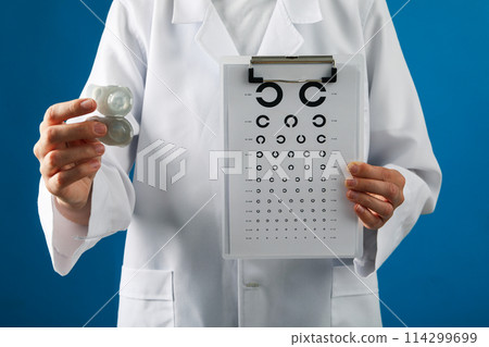 A container for contact lenses in the hand of a doctor A container for contact lenses in the hand of a doctor 114299699