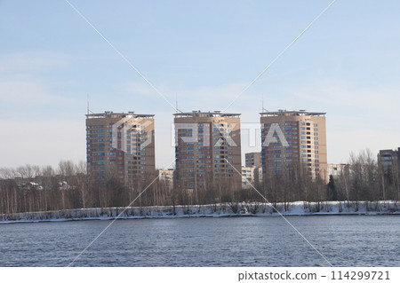 river on a sunny evening. Trees and shrubs. Landscape of winter nature, river banks  114299721