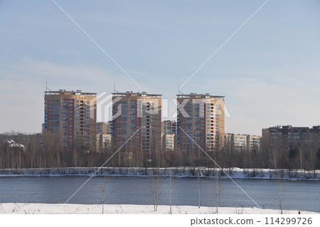 river on a sunny evening. Trees and shrubs. Landscape of winter nature, river banks  114299726