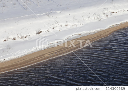 river on a sunny evening. Trees and shrubs. Landscape of winter nature, river banks river on a sunny evening. Trees and shrubs. Landscape of winter nature, river banks 114300689