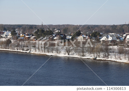river on a sunny evening. Trees and shrubs. Landscape of winter nature, river banks  114300813