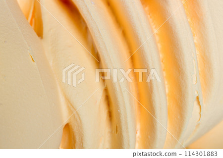 Close up of whipped orange cream. Close up of whipped orange cream. 114301883