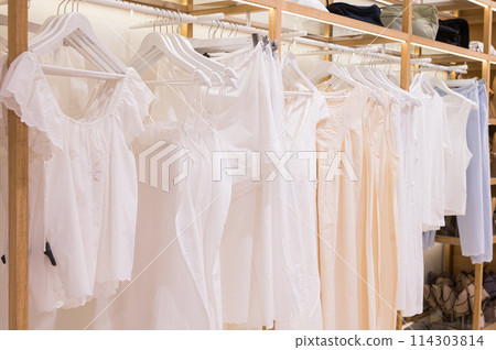 Dad and son in the front seat of a car driving a black car 114303814