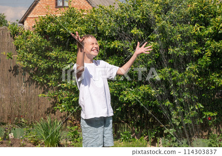 Dad and son in the front seat of a car driving a black car 114303837