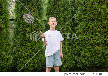 Dad and son in the front seat of a car driving a black car 114303838