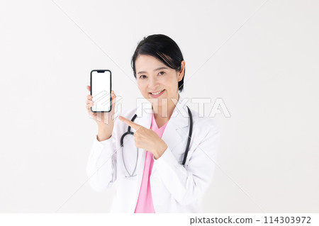 Middle-aged woman, white coat, smartphone Middle-aged woman, white coat, smartphone 114303972