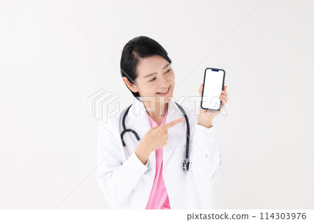 Middle-aged woman, white coat, smartphone Middle-aged woman, white coat, smartphone 114303976