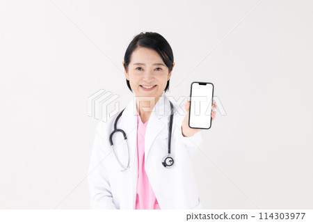 Middle-aged woman, white coat, smartphone 114303977