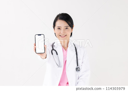 Middle-aged woman, white coat, smartphone 114303979