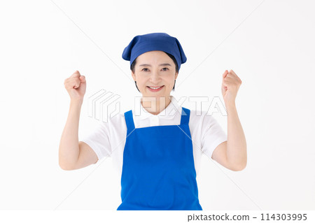 Middle-aged woman, uniform, apron, fist pump 114303995