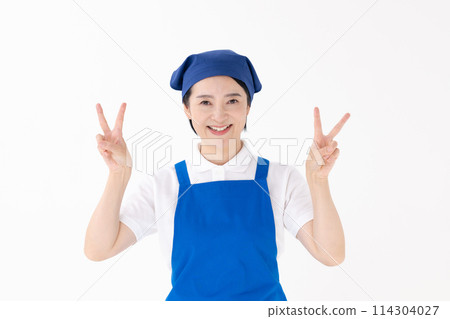 Middle-aged woman, uniform, apron, peace sign 114304027