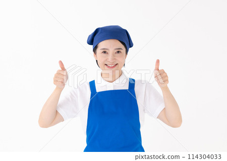 Middle-aged woman, uniform, apron, thumbs up 114304033