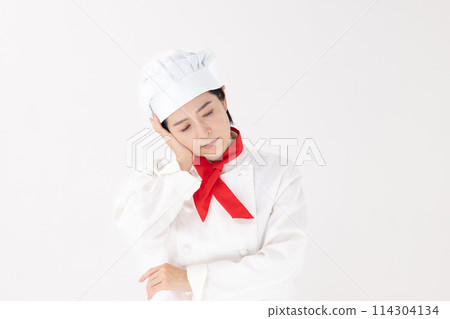 Middle-aged woman, chef uniform, worries Middle-aged woman, chef uniform, worries 114304134