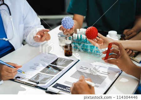 Doctor team, analysis the blood test examination results and medication usage of the patient on the chart, medical check-up concept. 114304446