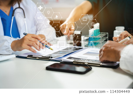 Doctor team, analysis the blood test examination results and medication usage of the patient on the chart, medical check-up concept. Doctor team, analysis the blood test examination results and medication usage of the patient on the chart, medical check-up concept. 114304449