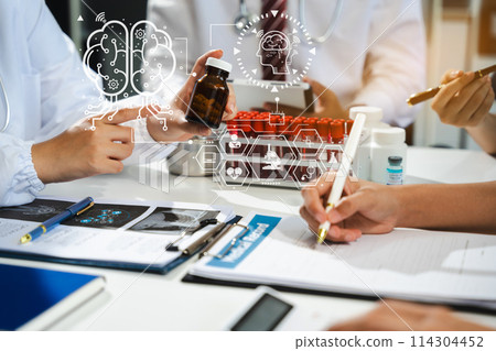 Doctor team, analysis the blood test examination results and medication usage of the patient on the chart, medical check-up concept. 114304452