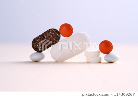 Pills and antibiotics on a blue background. 114309267