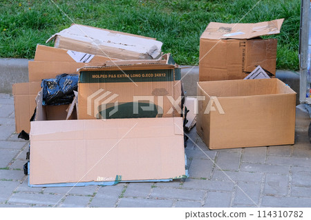 Cardboard and waste paper is packaged for recycling. Waste stacked. Pile of cardboard is sorting for recycled. Cardboard and waste paper is packaged for recycling. Waste stacked. Pile of cardboard is sorting for recycled. 114310782