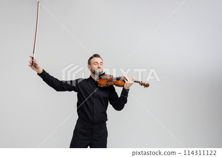 Attractive bearded violist man playing instrument Attractive bearded violist man playing instrument 114311122