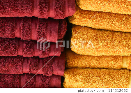 red and orange Bath towels display on the shelf in shop red and orange Bath towels display on the shelf in shop 114312662