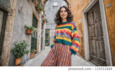 Smiling Woman in Colorful Striped Sweater on Rustic Street Smiling Woman in Colorful Striped Sweater on Rustic Street 114312884