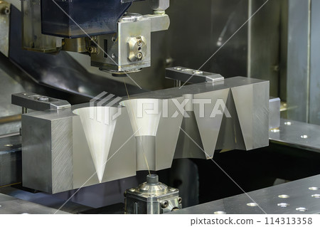 Closeup scene the wire EDM machine cutting the mold insert parts. 114313358
