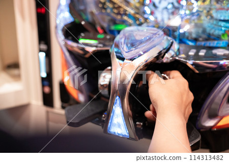 Man playing pachinko 114313482