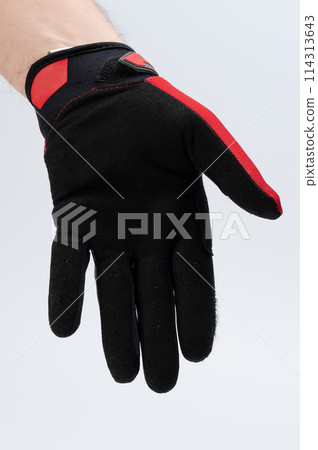 Human hand in black sport glove Human hand in black sport glove 114313643