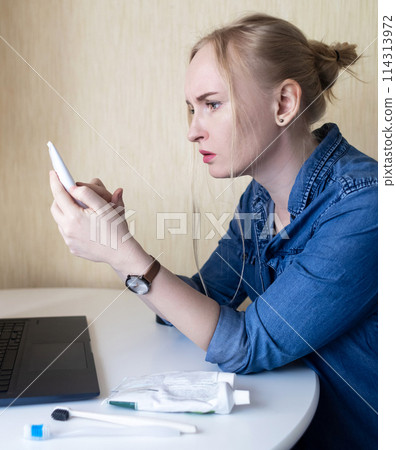 Toothpaste ingredients. Girl at laptop checks composition of toothpaste and is surprised by dangerous composition of product. Emulsifiers, preservatives, dyes, PEG, SLS, parabens, diethanolamine Toothpaste ingredients. Girl at laptop checks composition of toothpaste and is surprised by dangerous composition of product. Emulsifiers, preservatives, dyes, PEG, SLS, parabens, diethanolamine 114313972