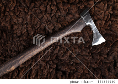 Battle axe on sheep fur 114314549