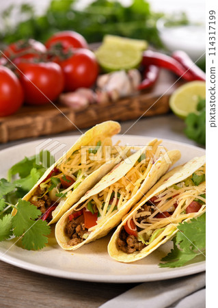 Taco with ground beef, cabbage and cheese Taco with ground beef, cabbage and cheese 114317199