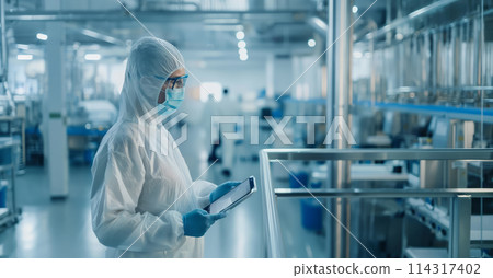 Person in White Suit and Mask Holding Clipboard 114317402