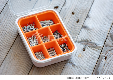 Collection of nails, screws and bolts in plastic box Collection of nails, screws and bolts in plastic box 114317895