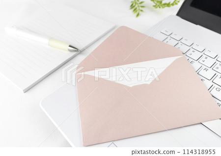 A computer, an envelope, and letter paper. Image of writing an email A computer, an envelope, and letter paper. Image of writing an email 114318955