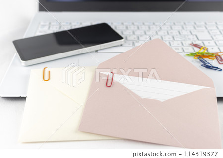 A computer, a smartphone, an envelope, and a clip. Image of an attached file A computer, a smartphone, an envelope, and a clip. Image of an attached file 114319377