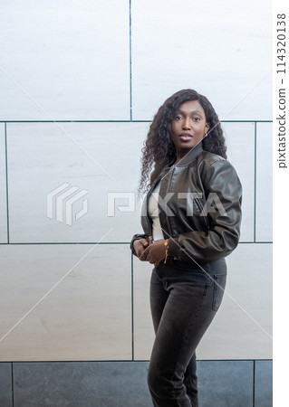 Fashionable Black Woman in Modern Urban Background Fashionable Black Woman in Modern Urban Background 114320138