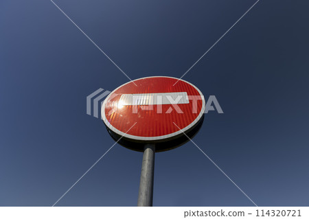 red round sign with a white rectangle forbidding entry to the road red round sign with a white rectangle forbidding entry to the road 114320721