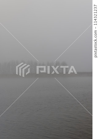 river in winter in foggy weather in the morning river in winter in foggy weather in the morning 114321237