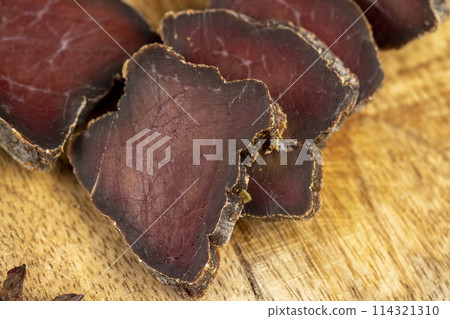 pieces of soft dried beef meat close-up 114321310