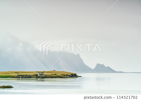 Ruin house in Hofn in a foggy morning, Iceland Ruin house in Hofn in a foggy morning, Iceland 114321702