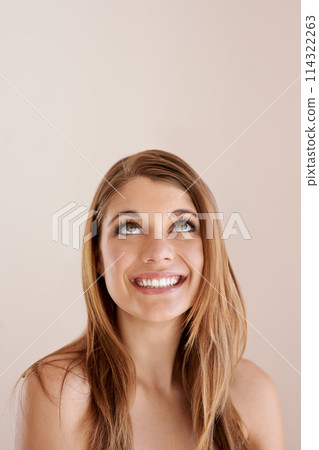 Beauty, hair care and happy woman looking up, skincare and face treatment isolated on a brown studio background mockup space. Thinking, hairstyle and model in makeup cosmetics at hairdresser salon Beauty, hair care and happy woman looking up, skincare and face treatment isolated on a brown studio background mockup space. Thinking, hairstyle and model in makeup cosmetics at hairdresser salon 114322263