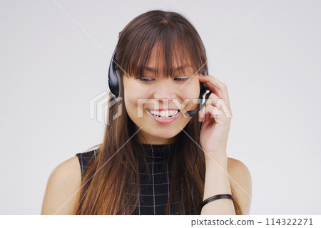 Virtual assistant, woman and headset with smile in studio for communication and customer service. Asian female person, consultant and microphone for talking, telemarketing and crm agent in studio 114322271