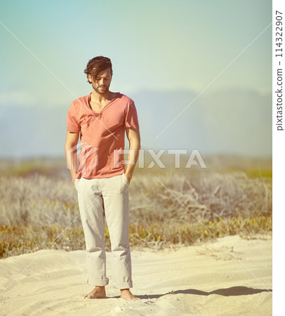 Man, barefoot and alone deserted on outdoor sand for adventure, journey and solo holiday getaway. Person, walking and thinking in summer heat for travel, vacation or exploration of the wilderness Man, barefoot and alone deserted on outdoor sand for adventure, journey and solo holiday getaway. Person, walking and thinking in summer heat for travel, vacation or exploration of the wilderness 114322907