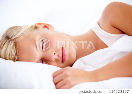 Bedroom, woman and sleeping with peace, tired and home with comfort, pillow and resting while dreaming. Mockup space, fatigue and exhausted person, taking a nap with a comfortable blanket and relax 114323137