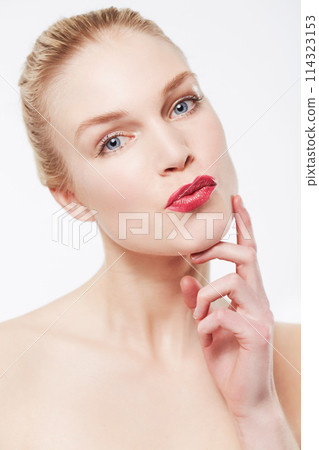 Portrait, skincare and woman in red lipstick, makeup and cosmetics in studio isolated on a white background. Face, model and beauty in spa facial treatment for wellness, touch skin and healthy glow Portrait, skincare and woman in red lipstick, makeup and cosmetics in studio isolated on a white background. Face, model and beauty in spa facial treatment for wellness, touch skin and healthy glow 114323153